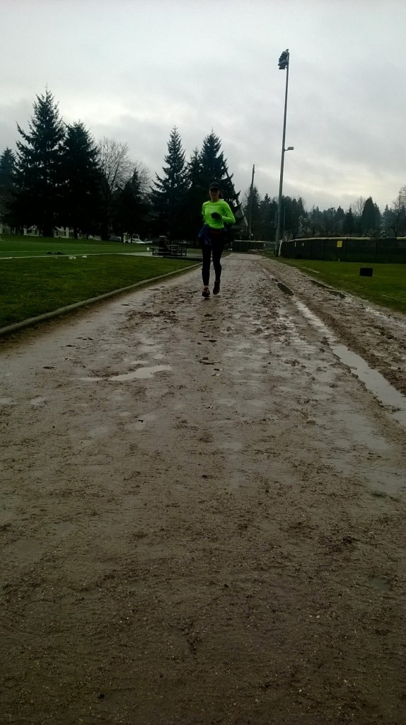 Julie finishing up her 5xmile workout on the dirt track.