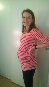 21 weeks in my favorite shirt to show off my belly and hide my butt!